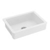 White ceramic kitchen sink in front of farmhouse/apron