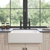 White ceramic kitchen sink in front of farmhouse/apron